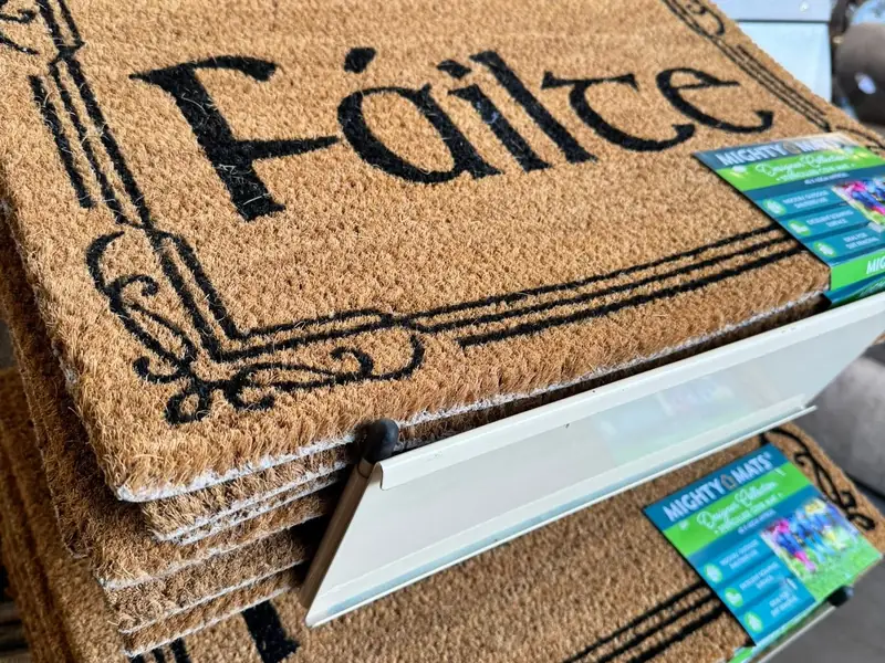 Decorative doormats displayed in the Farrells showroom.